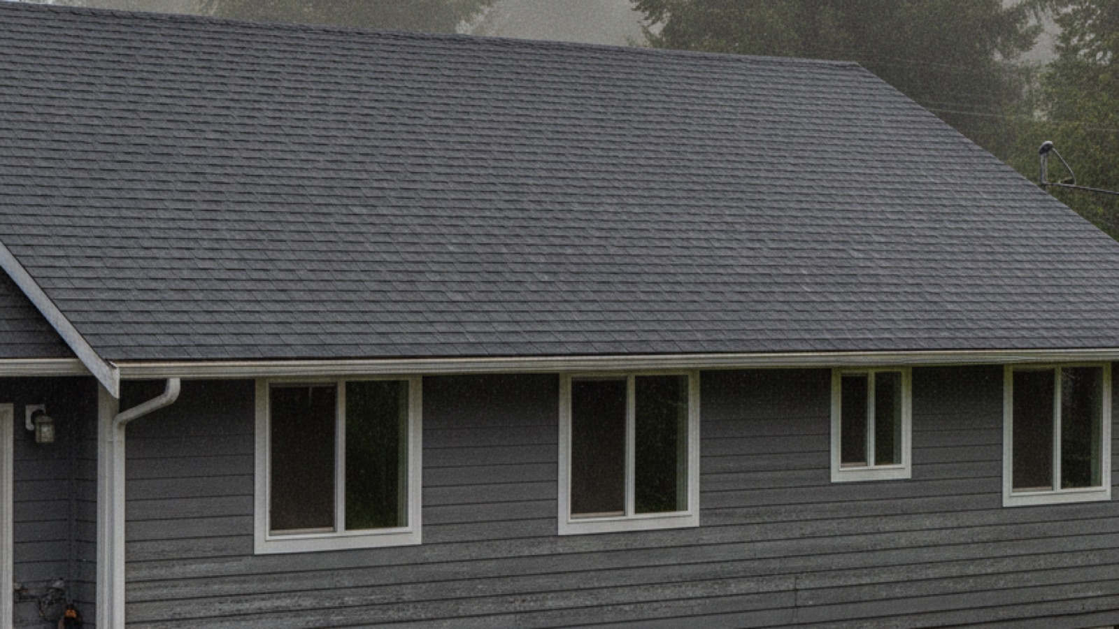 Vancouver WA residential home with dark architectural asphalt shingle roof under an overcast Pacific Northwest winter sky